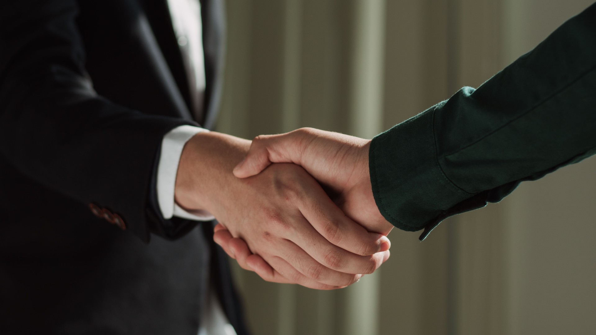 businessman making handshake to success deal to be partnership. Two business men agreement company trade partnership handshake, dealing, merger and acquisition, business partner joint venture concept.